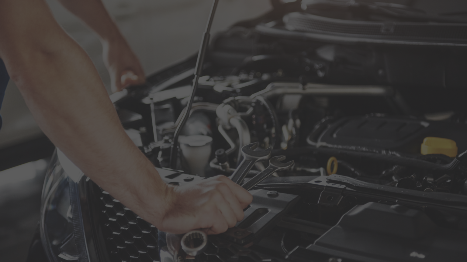K9 technician working on a vehicle engine
